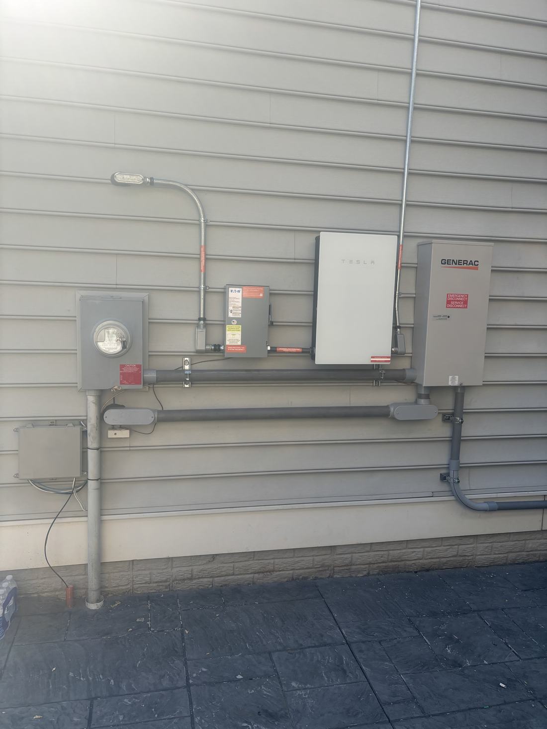 Meter, disconnect and transfer switch installed on siding