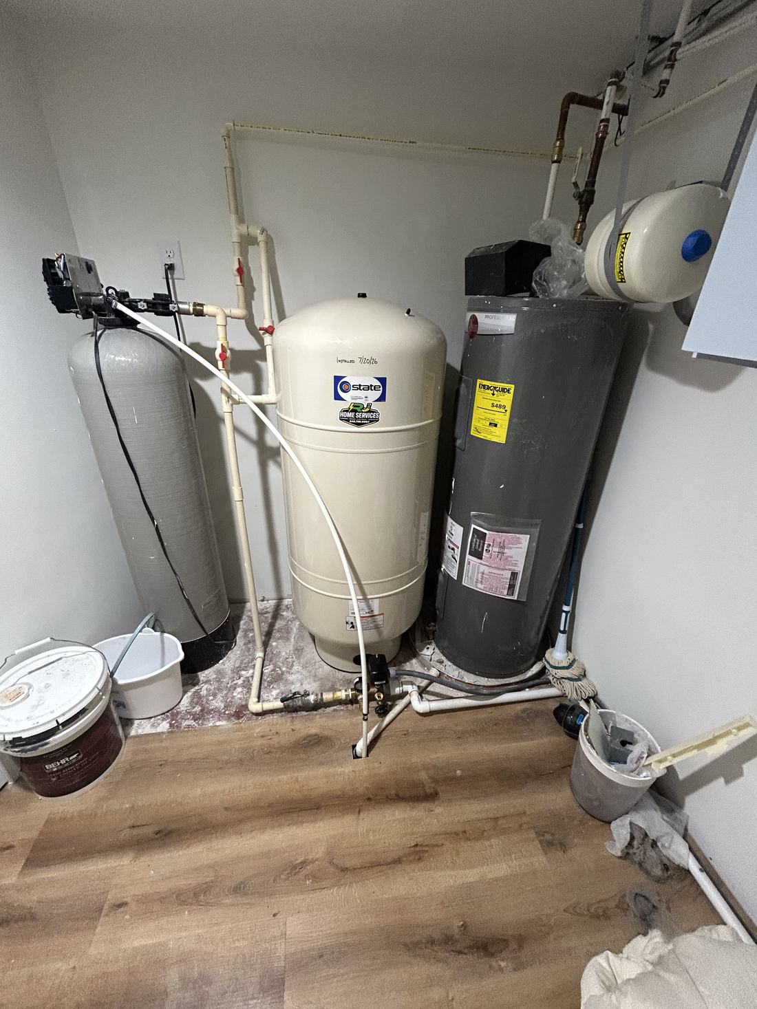 Well water pressure tank and treatment system